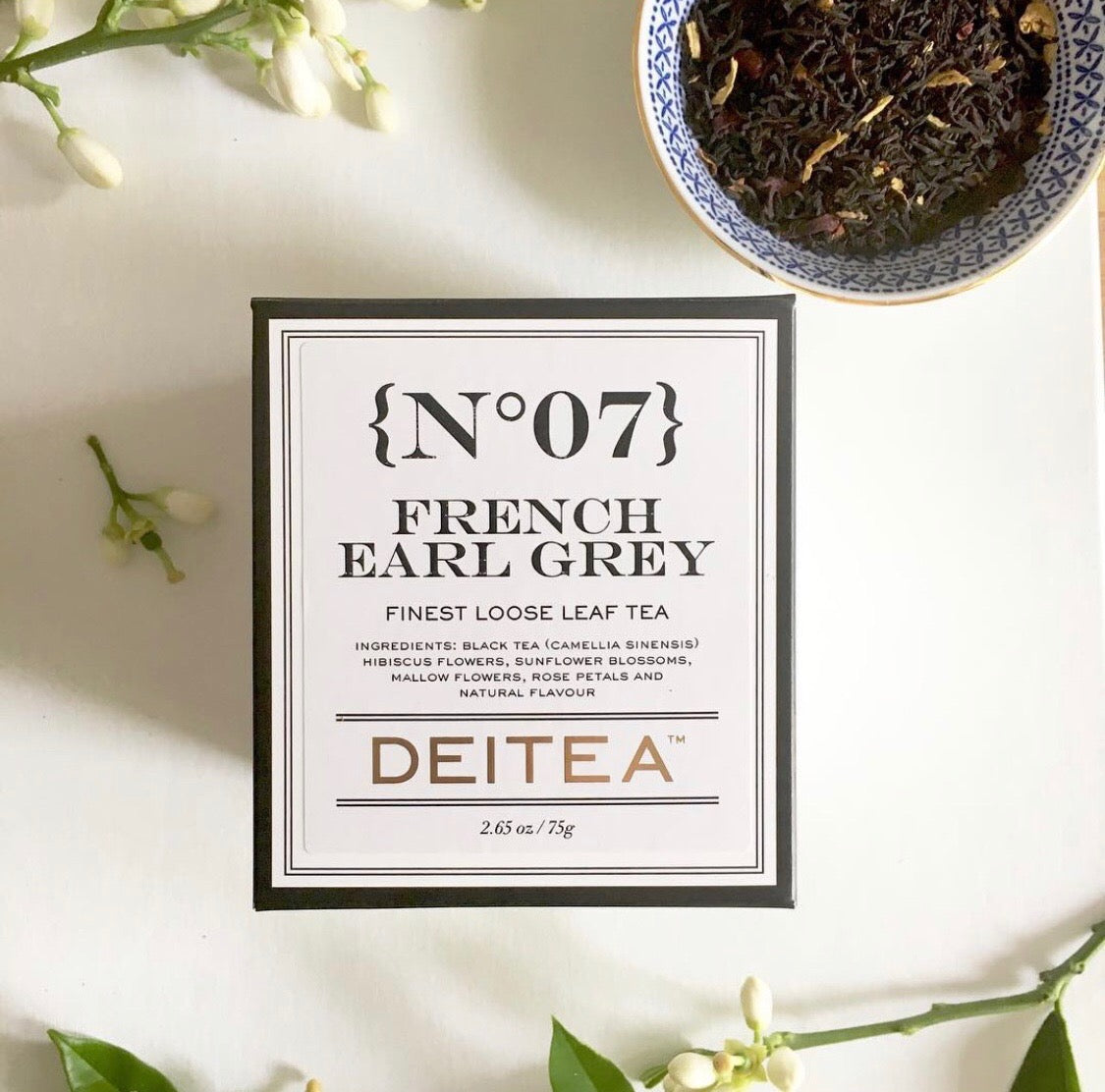 Loose leaf floral black tea with rose petals in elegant black and white packaging – French Earl Grey style