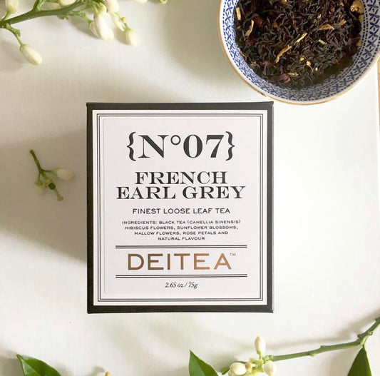 Loose leaf floral black tea with rose petals in elegant black and white packaging – French Earl Grey style